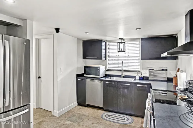 a view of a lake with houses in the back