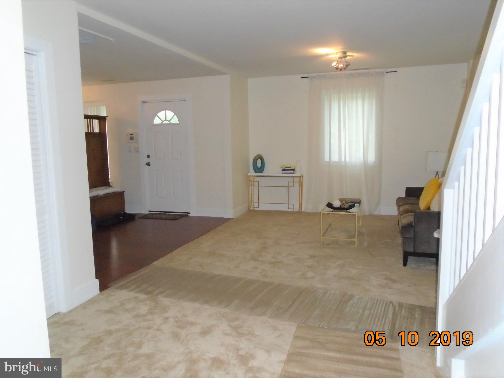 2419 Darrow Street Silver Spring, MD 20902 - Photo 9 of 33 a bedroom with a bed and a couch