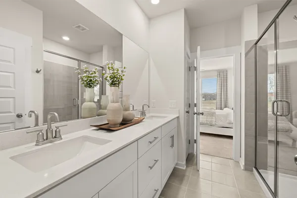 a bathroom with a sink and shower