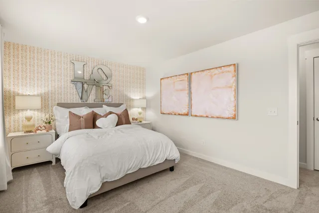 a bed room with a bed mirror and a window