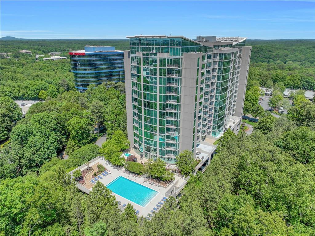 3300 Windy Ridge Parkway Southeast, Unit 1603 Atlanta, GA 30339 - Photo 1 of 36 a view of a garden with a lounge chair