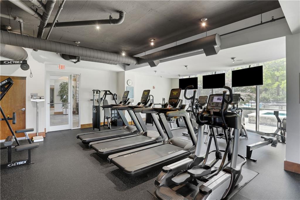 3300 Windy Ridge Parkway Southeast, Unit 1603 Atlanta, GA 30339 - Photo 23 of 36 a view of a room with gym equipment
