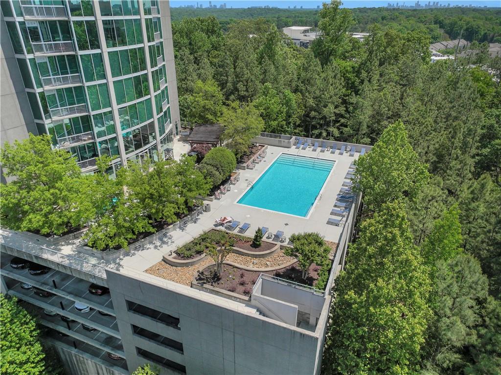 3300 Windy Ridge Parkway Southeast, Unit 1603 Atlanta, GA 30339 - Photo 33 of 36 a view of a backyard with plants and outdoor seating