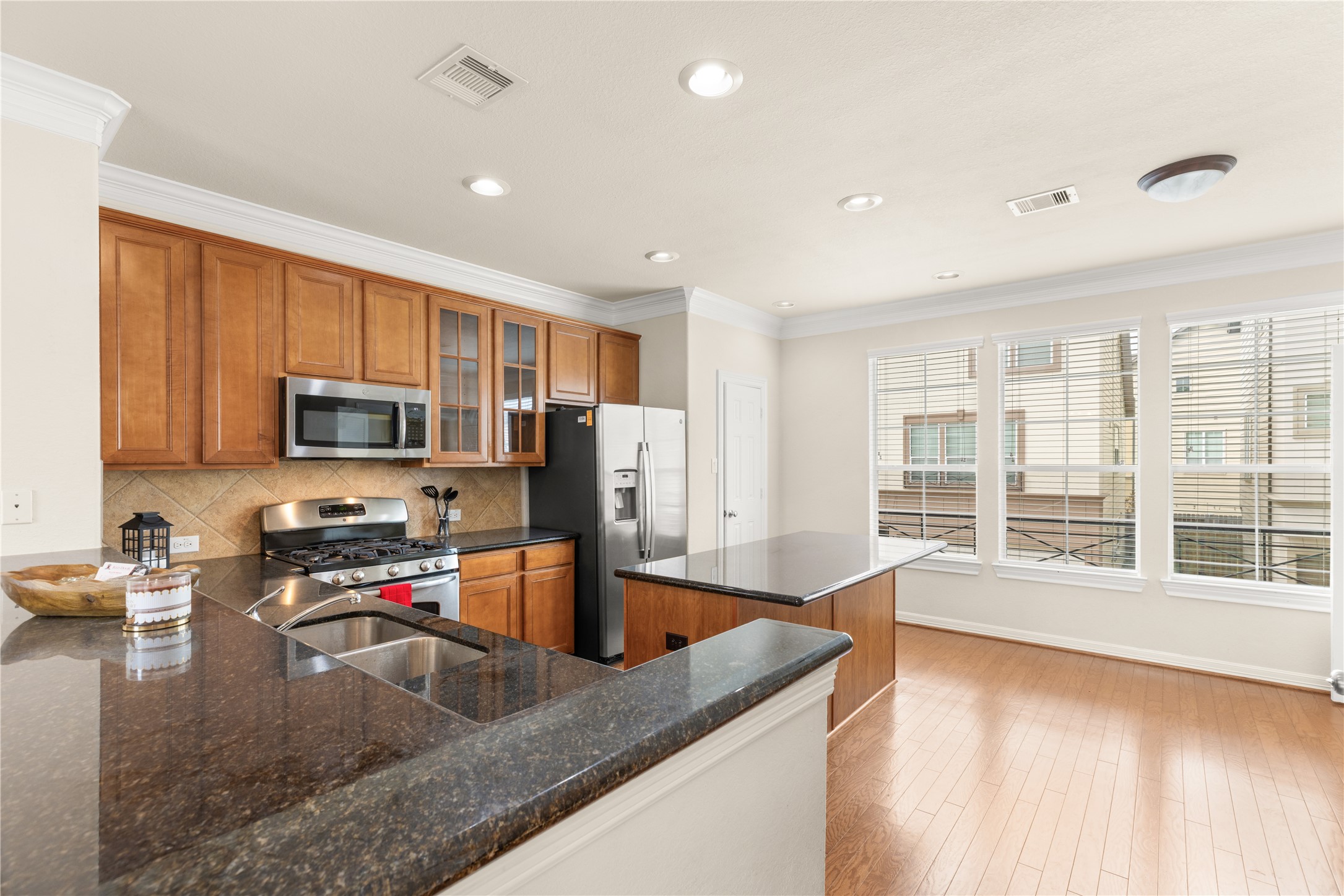 3334 Clearview Villa Way Houston, TX 77025 - Photo 9 of 35 This bright kitchen features modern stainless steel appliances, granite countertops, and ample cabinet space. Large windows provide plenty of natural light, and the open layout is perfect for entertaining.