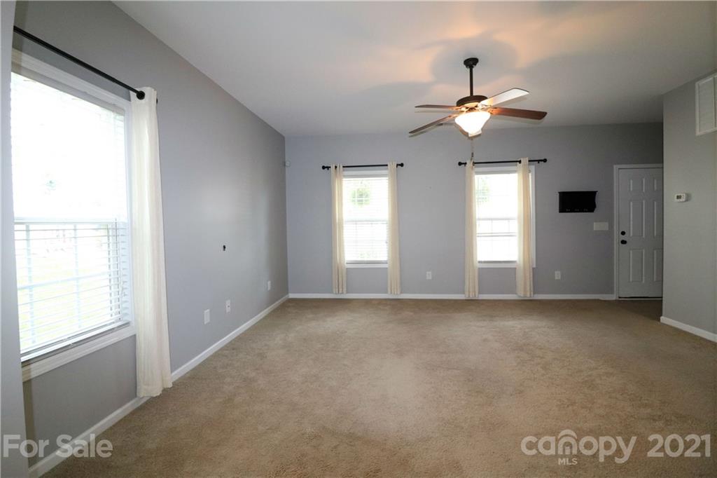 440 Danielle Way Fort Mill, SC 29715 - Photo 11 of 19 a view of an empty room with window and chandelier fan