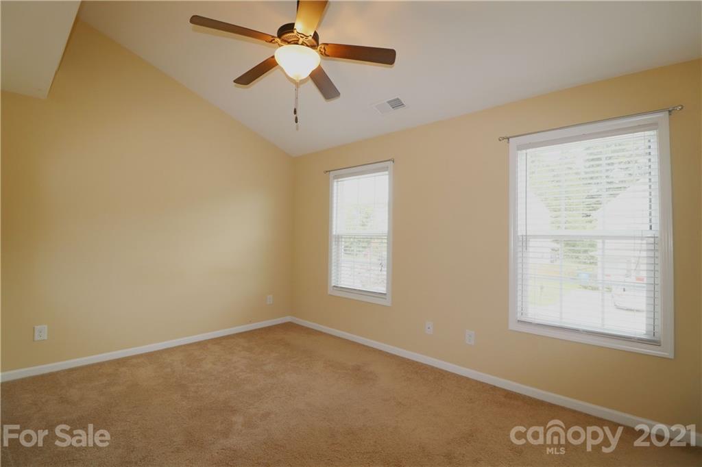 440 Danielle Way Fort Mill, SC 29715 - Photo 13 of 19 en empty room with windows and ceiling fan