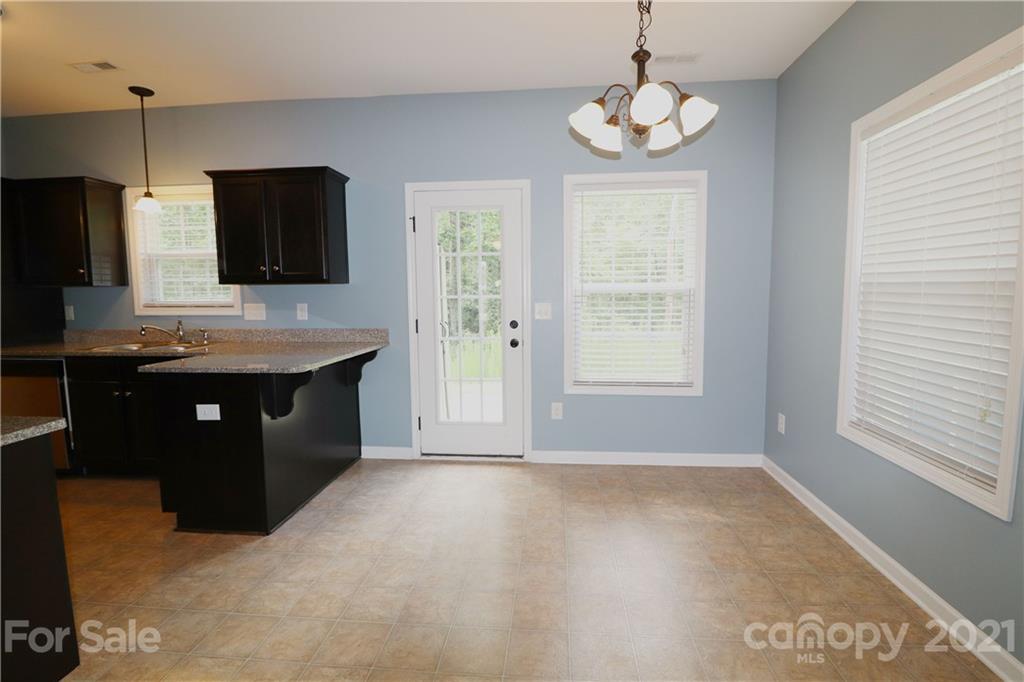 440 Danielle Way Fort Mill, SC 29715 - Photo 8 of 19 a kitchen with a sink wooden floor and a window