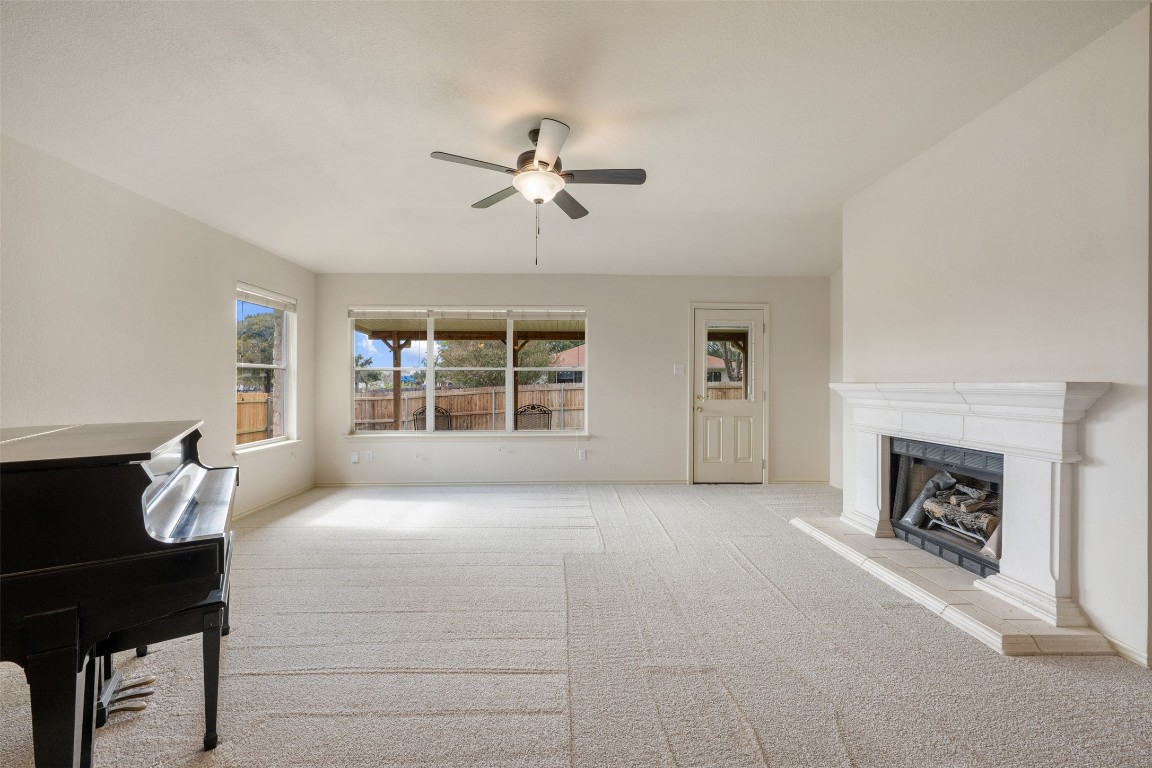 1201 Rice Avenue Cedar Park, TX 78613 - Photo 15 of 40 Lots of natural light and a gas log fireplace~Recent carpet-10/25
