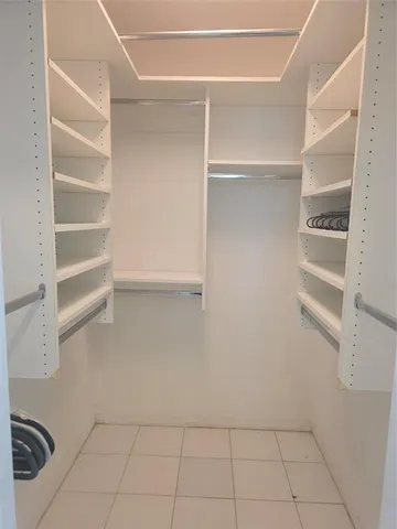 a view of an empty walk in closet