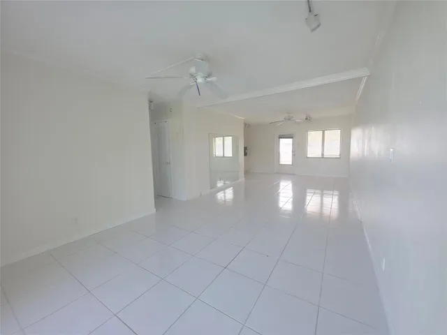 a view of empty room with windows