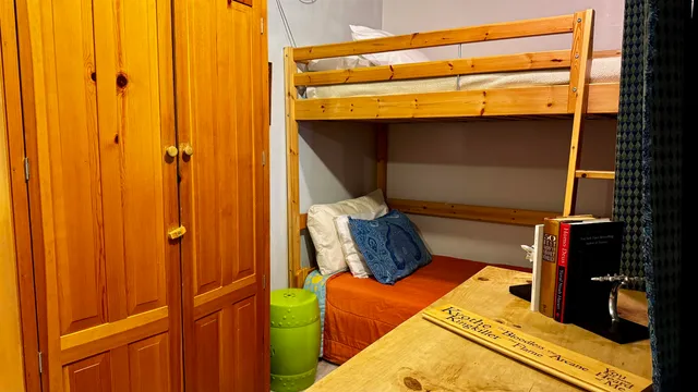 view of walk in closet with clothes and shoes