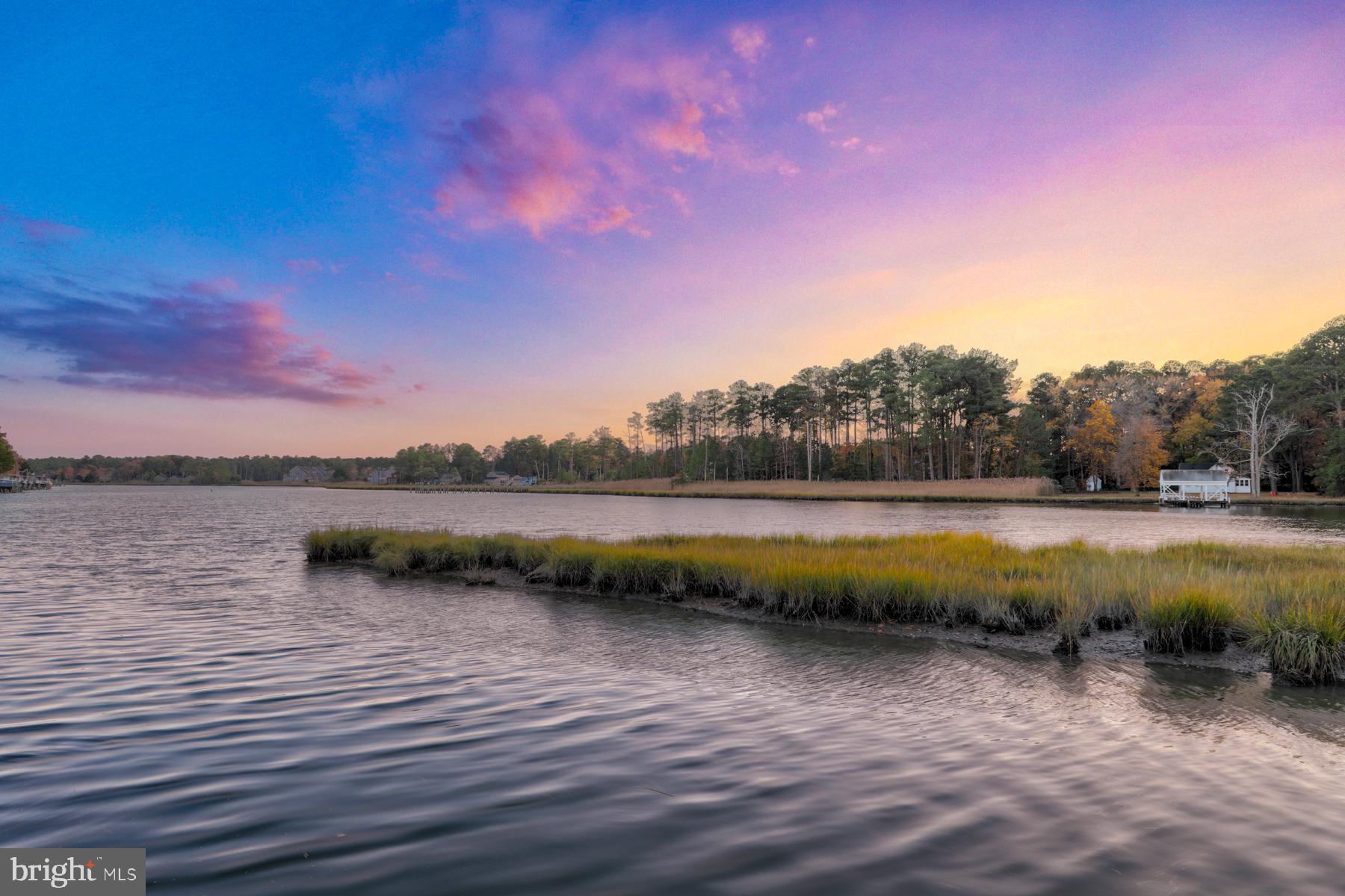 34 Watertown Road Ocean Pines, MD 21811 - Photo 8 of 75 Sunsets light up the sky across water and grasses
