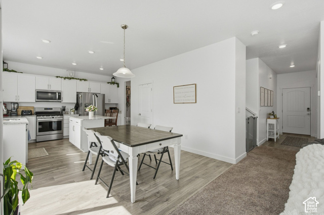 1113 South Raintree Lane Santaquin, UT 84655 - Photo 14 of 59 Open-concept kitchen with white cabinetry and stainless steel appliances