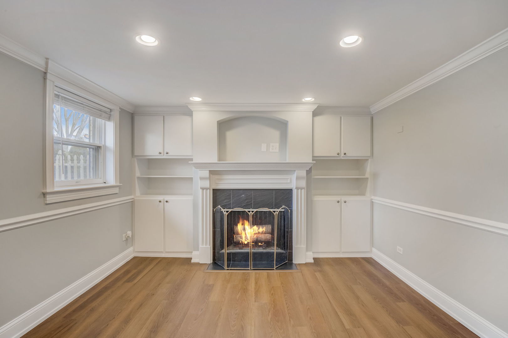 1673 East Algonquin Road Des Plaines, IL 60016 - Photo 13 of 36 a room with a fireplace and a fireplace