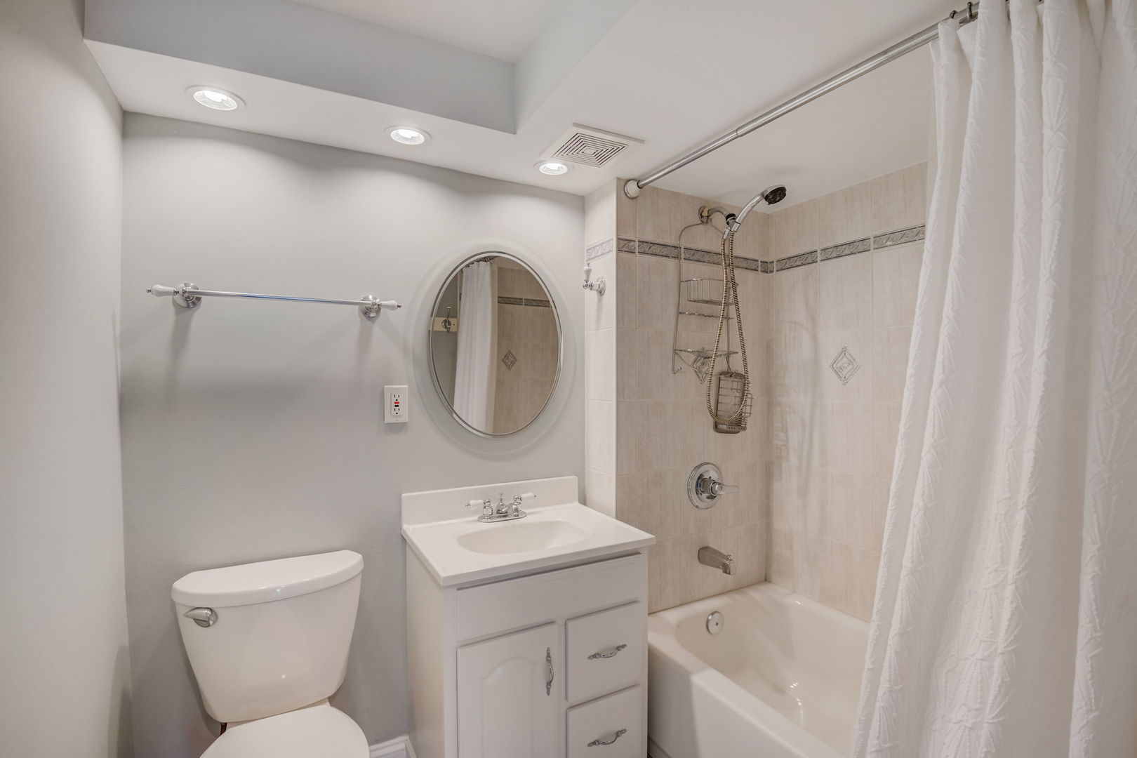 1673 East Algonquin Road Des Plaines, IL 60016 - Photo 15 of 36 a bathroom with a toilet sink shower and mirror