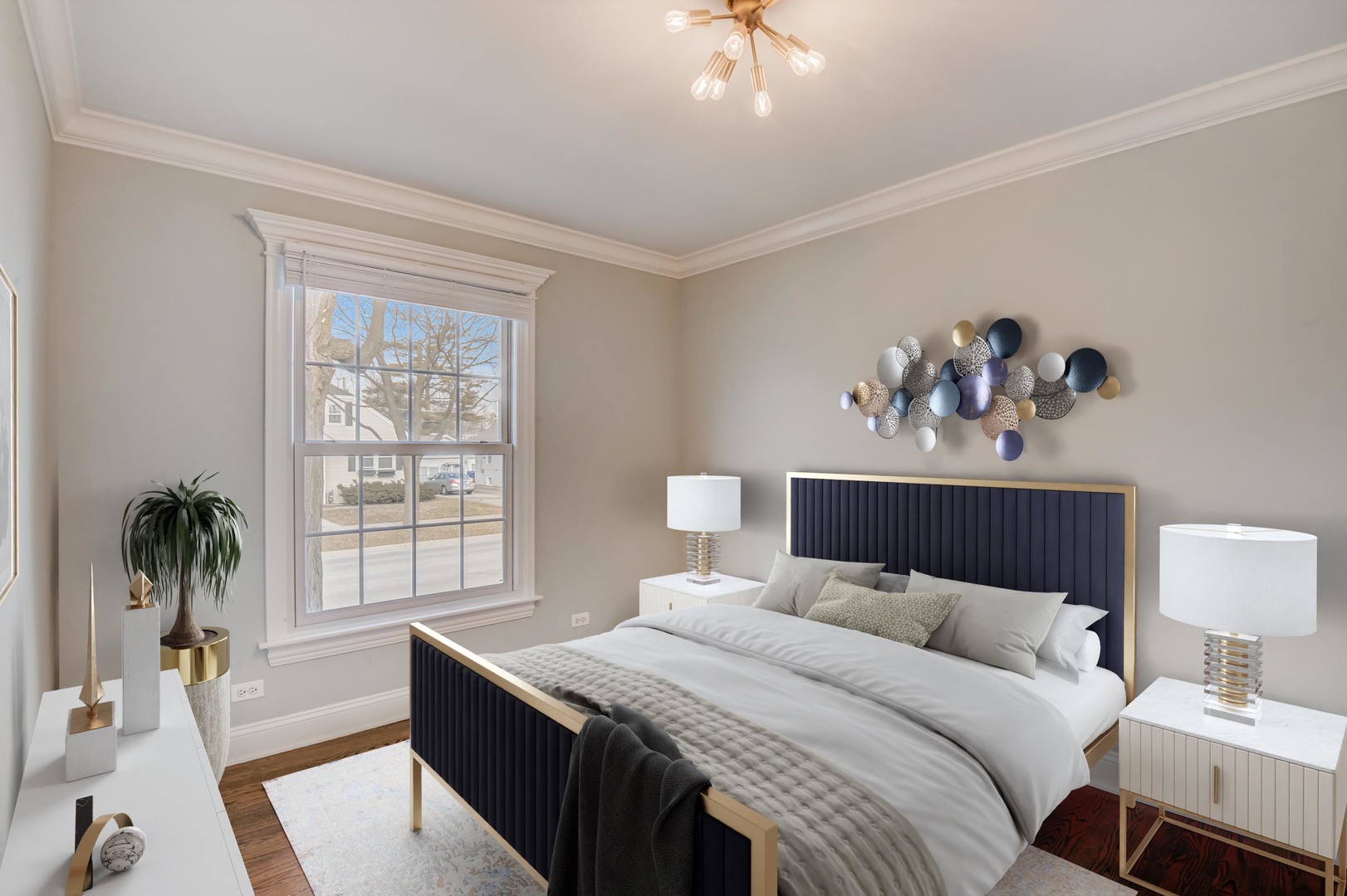 1673 East Algonquin Road Des Plaines, IL 60016 - Photo 17 of 36 a bedroom with a large bed and a chandelier