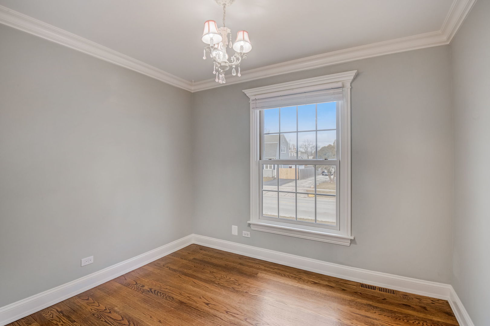 1673 East Algonquin Road Des Plaines, IL 60016 - Photo 18 of 36 a view of empty room with wooden floor and fan