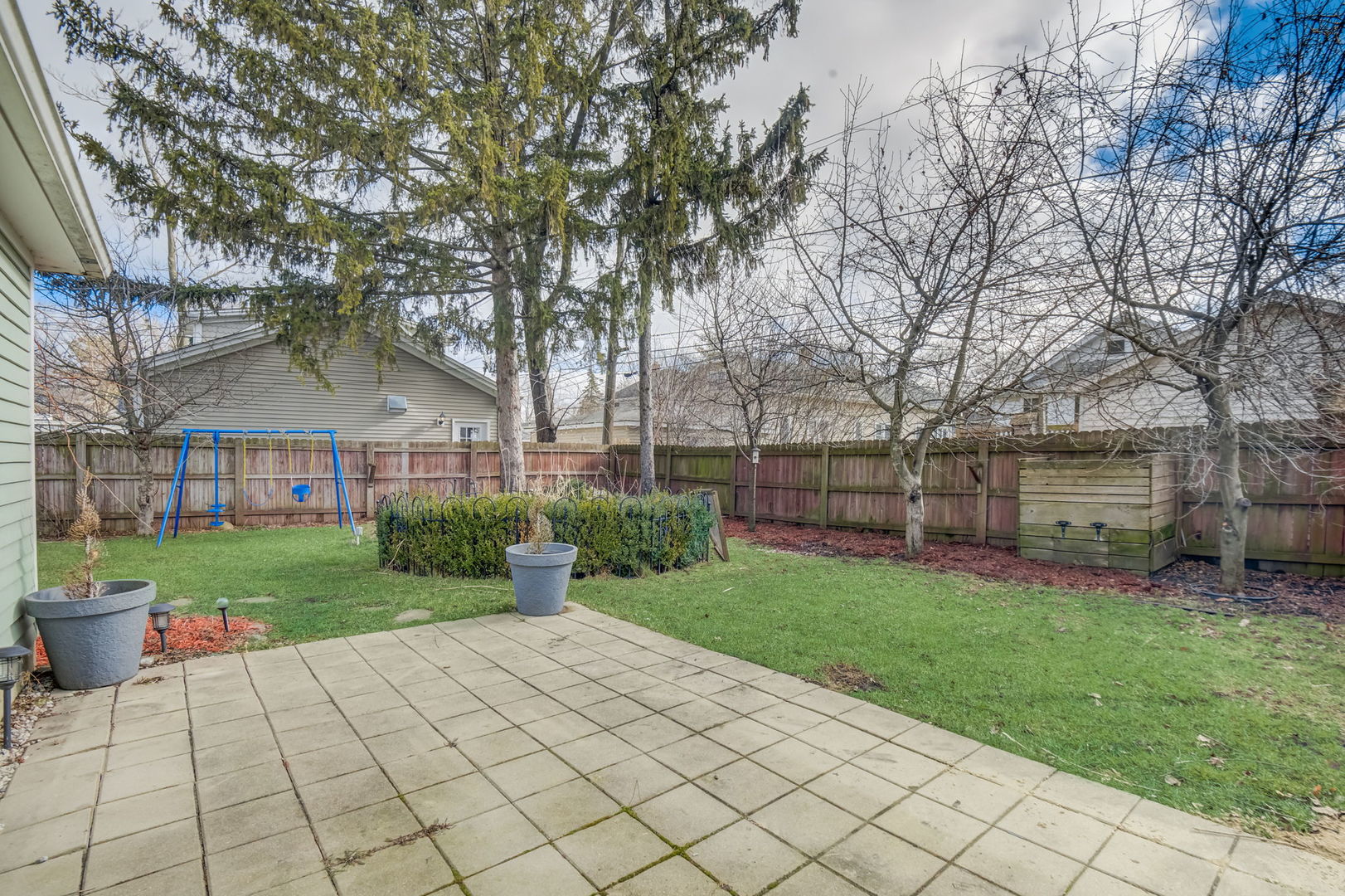 1673 East Algonquin Road Des Plaines, IL 60016 - Photo 26 of 36 a view of a house with backyard and garden