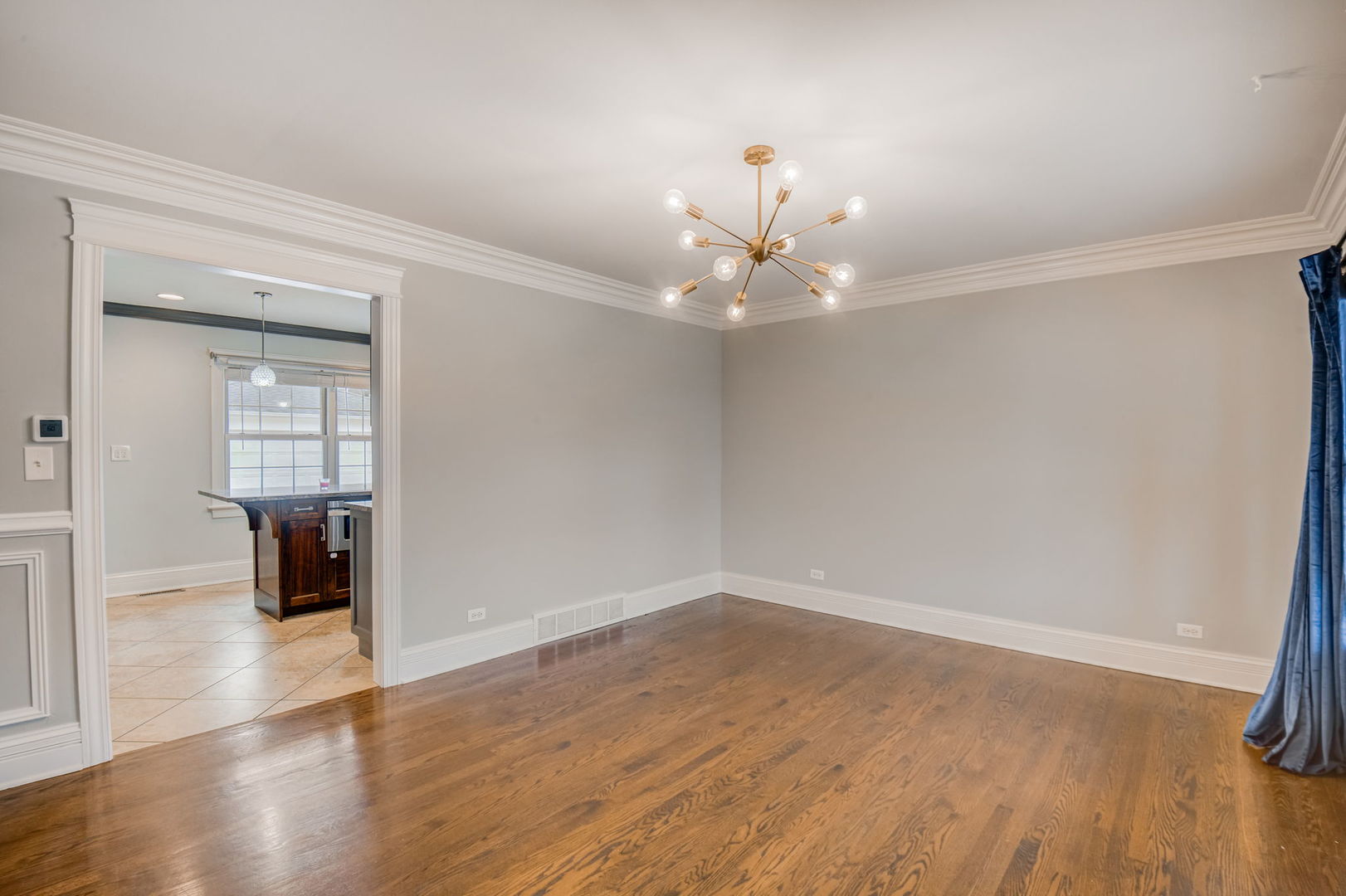 1673 East Algonquin Road Des Plaines, IL 60016 - Photo 4 of 36 wooden floor in an empty room with a window
