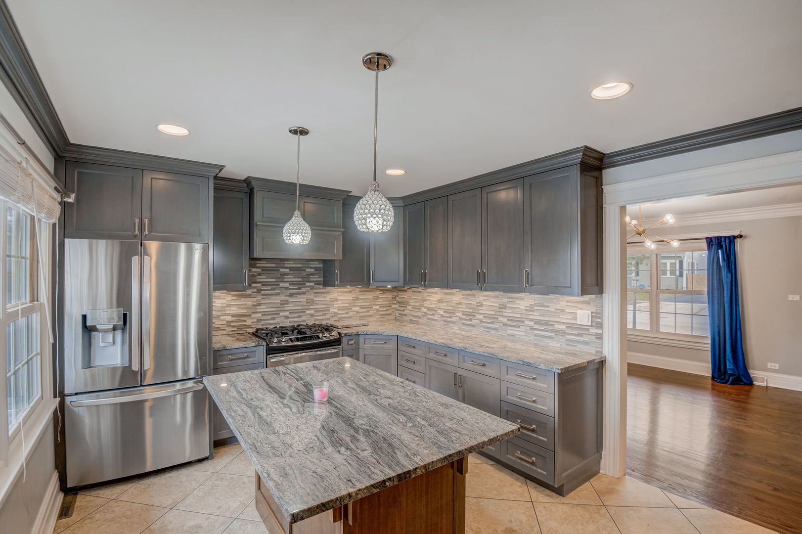 1673 East Algonquin Road Des Plaines, IL 60016 - Photo 6 of 36 a kitchen with kitchen island a counter top space stainless steel appliances and cabinets