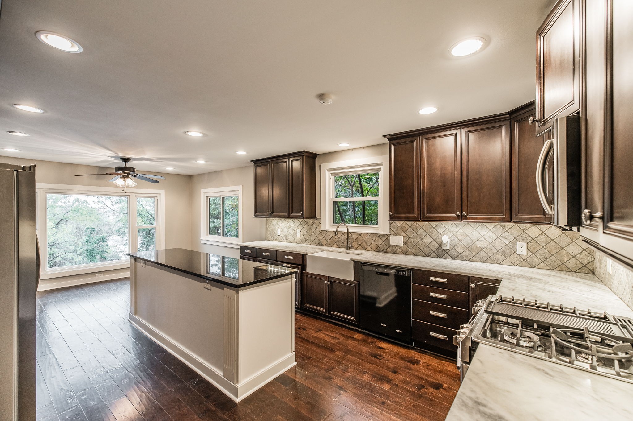 181 Lake Valley Road Hendersonville, TN 37075 - Photo 21 of 60 a kitchen with stainless steel appliances granite countertop sink stove top oven and cabinets