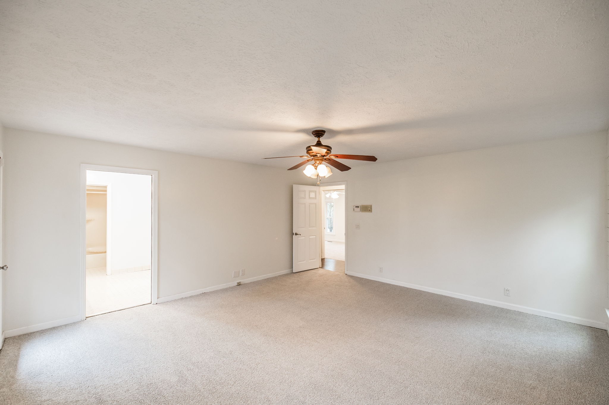 181 Lake Valley Road Hendersonville, TN 37075 - Photo 39 of 60 an empty room with chandelier fan and windows