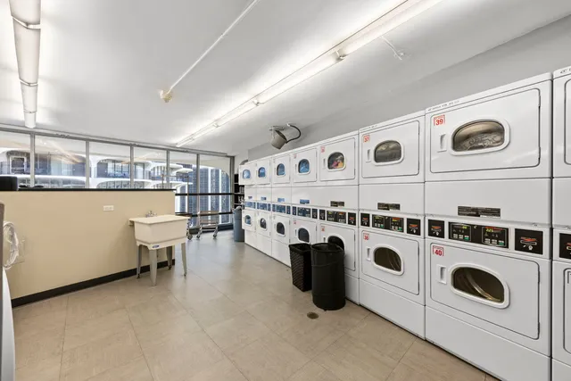 a kitchen with a stove and white cabinets