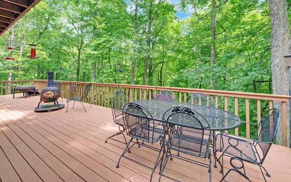 a view of a chairs and table on the wooden floor