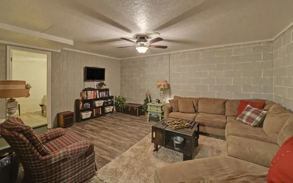 a view of a backyard with wooden fence