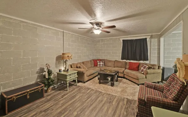 a view of storage and utility room with refrigerator and washer