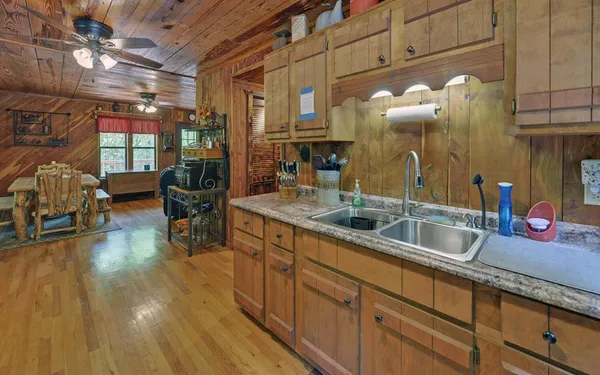 a kitchen with sink and cabinets