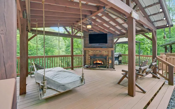 a view of a wooden deck with a yard