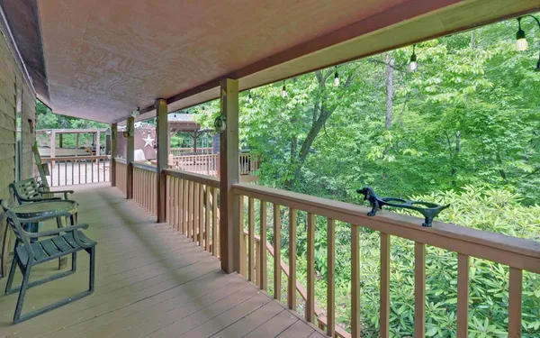a view of two chairs in the balcony