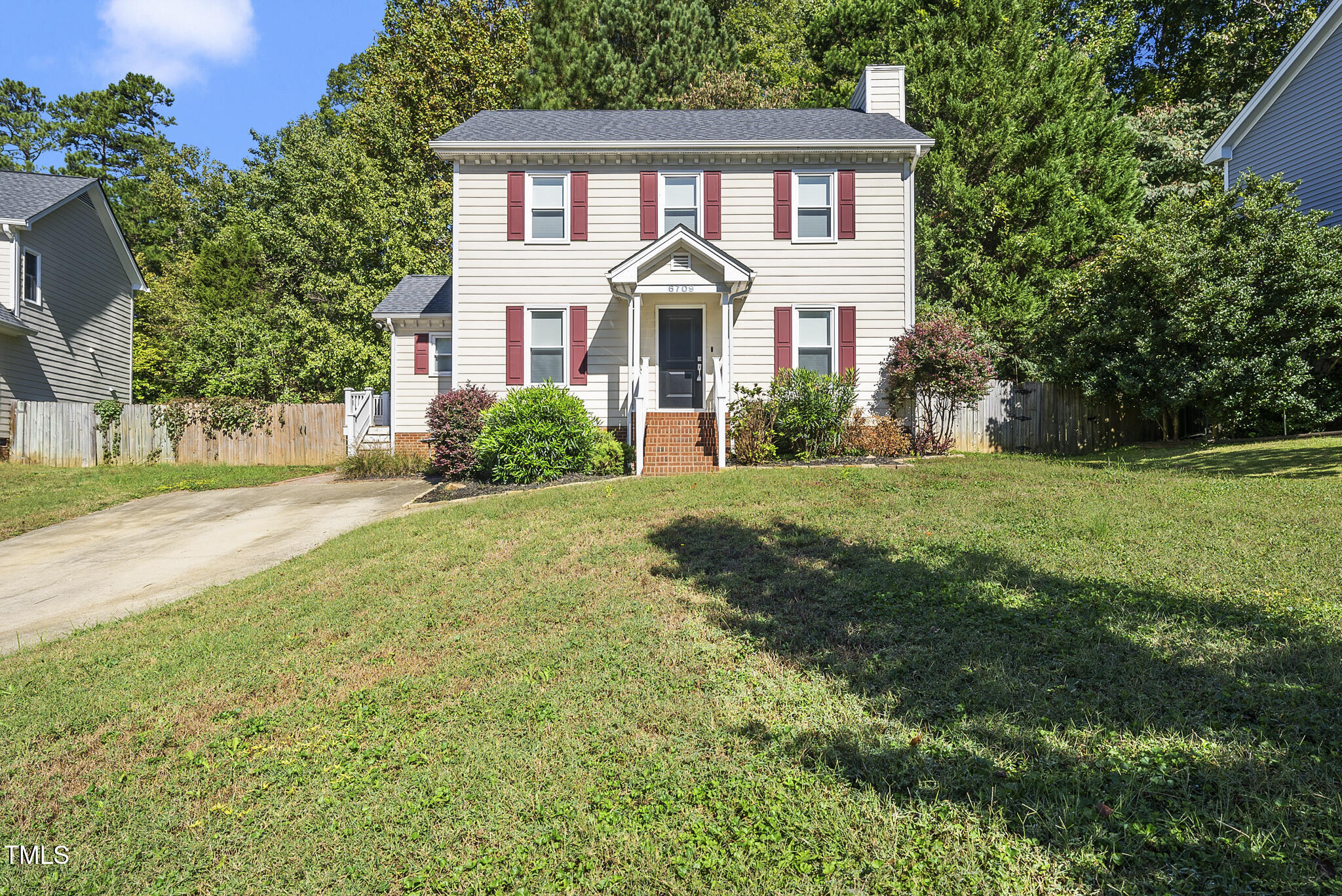 6709 Holly Mill Court Raleigh, NC 27613 - Photo 1 of 36 a front view of a house with a yard and garage