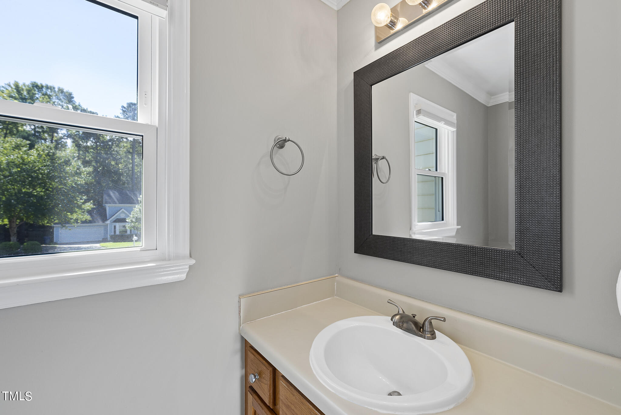 6709 Holly Mill Court Raleigh, NC 27613 - Photo 15 of 36 a bathroom with a sink and a mirror