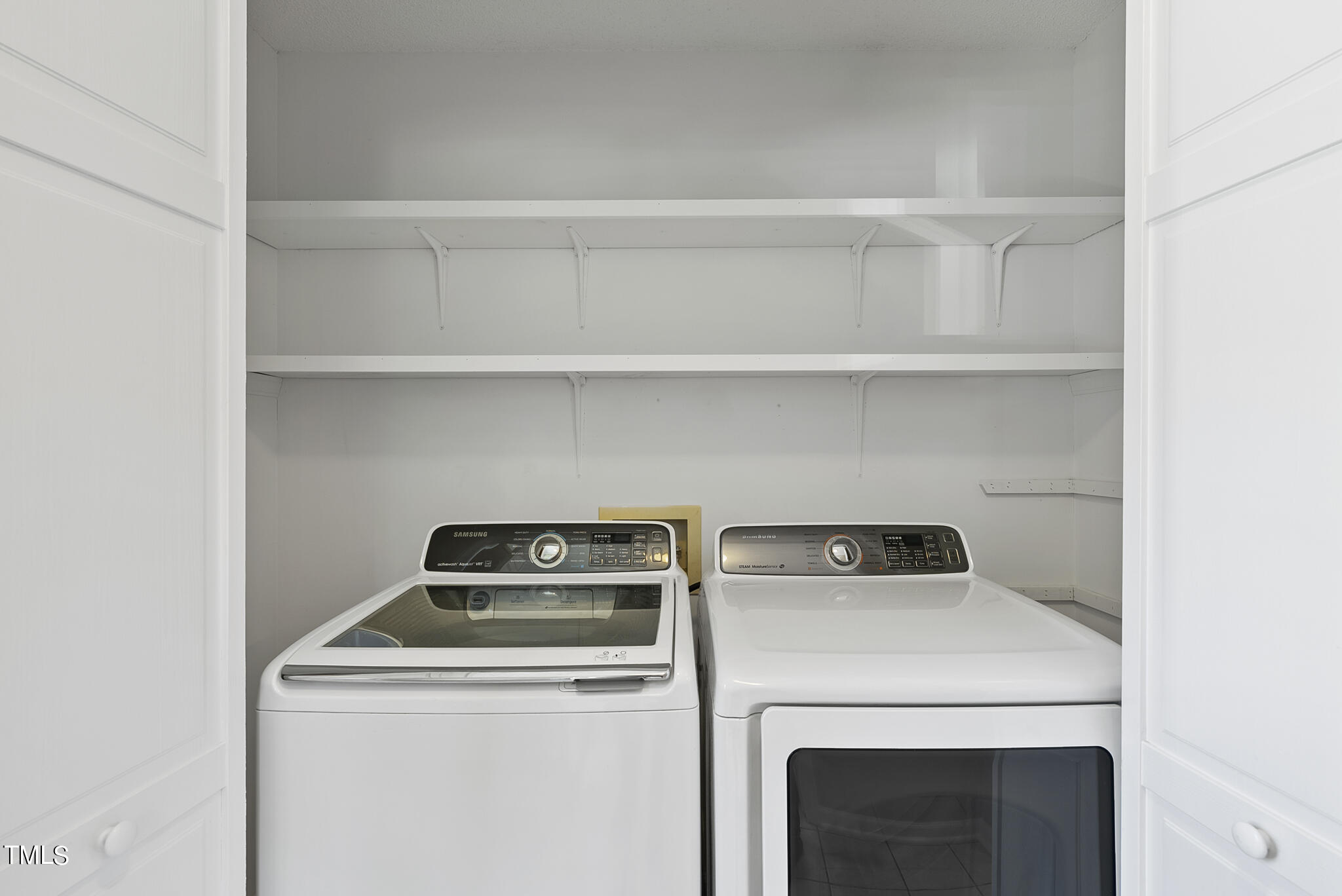 6709 Holly Mill Court Raleigh, NC 27613 - Photo 16 of 36 a utility room with dryer and washer