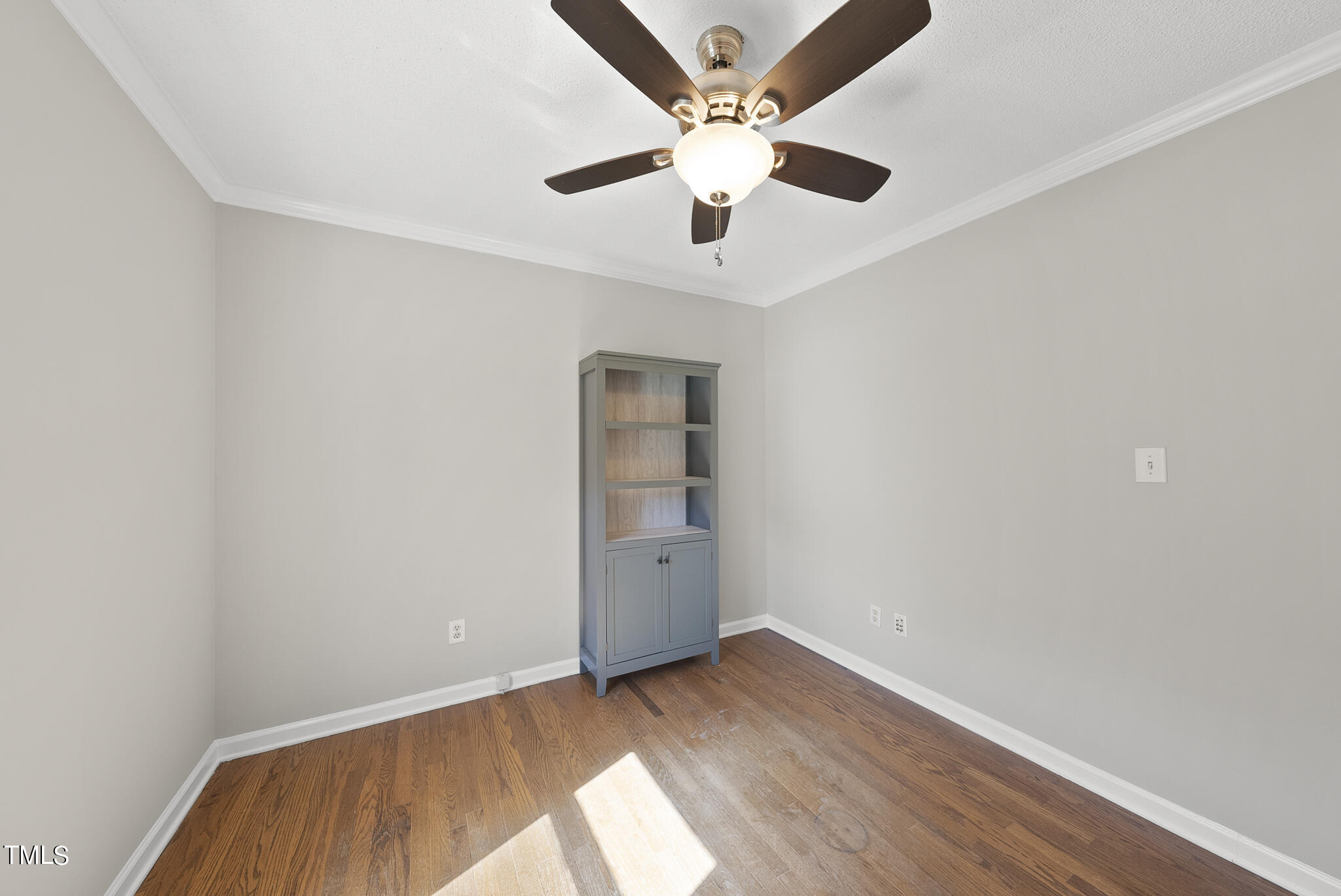 6709 Holly Mill Court Raleigh, NC 27613 - Photo 17 of 36 an empty room with a window and a ceiling fan