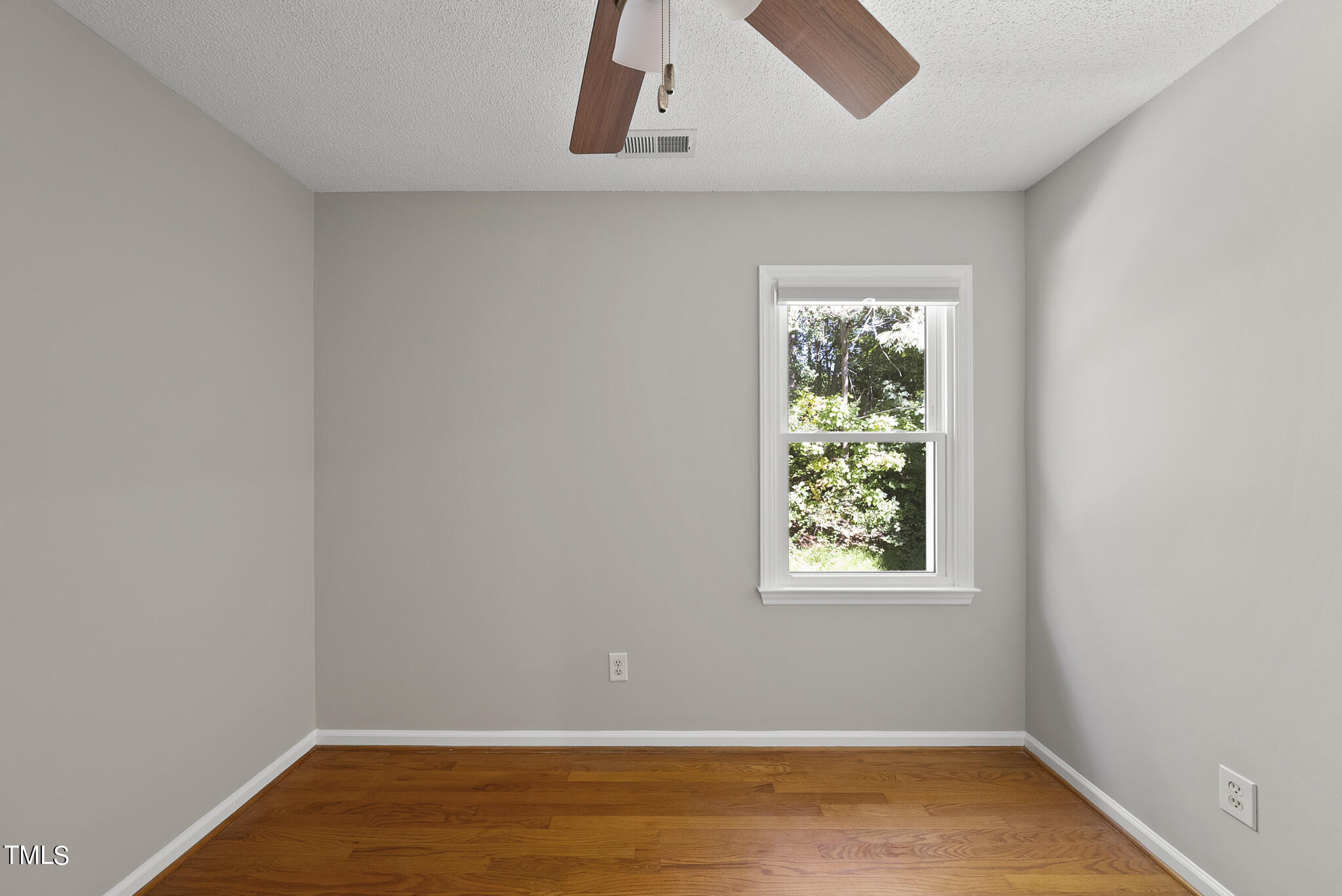 6709 Holly Mill Court Raleigh, NC 27613 - Photo 26 of 36 an empty room with a window