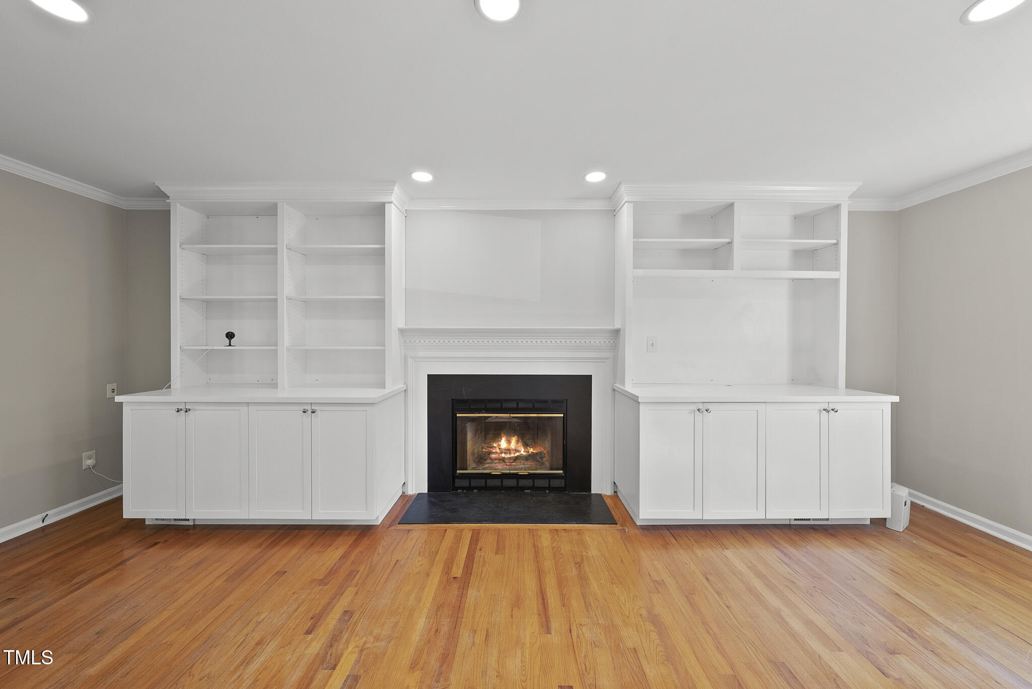 6709 Holly Mill Court Raleigh, NC 27613 - Photo 3 of 36 a living room with a fireplace