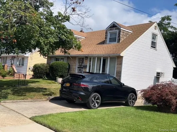 a car parked in front of a house