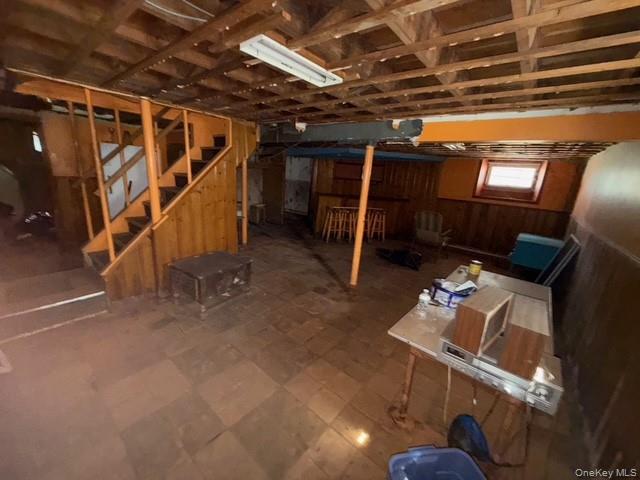 35 Marlow Road Valley Stream, NY 11580 - Photo 14 of 19 Below grade area featuring wood walls, tile patterned floors, and wainscoting