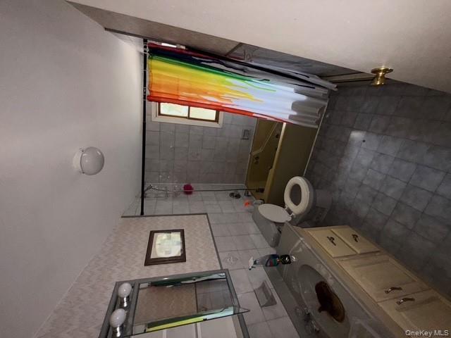 35 Marlow Road Valley Stream, NY 11580 - Photo 14 of 20 a bathroom with a granite countertop sink toilet and a bathtub