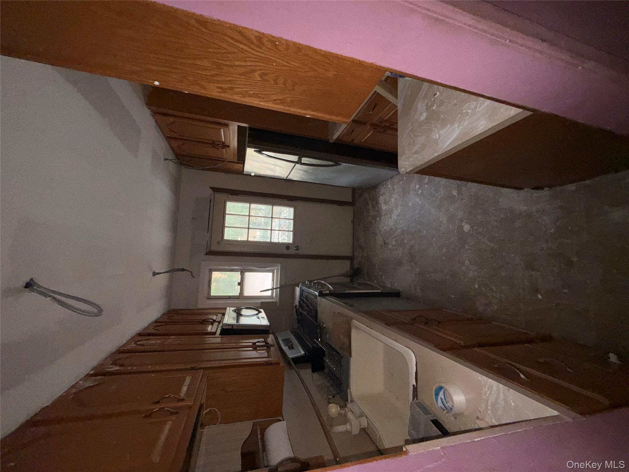 35 Marlow Road Valley Stream, NY 11580 - Photo 20 of 20 a kitchen with a sink a refrigerator and window