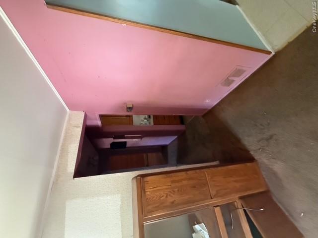 35 Marlow Road Valley Stream, NY 11580 - Photo 7 of 19 Hallway with crown molding and carpet floors