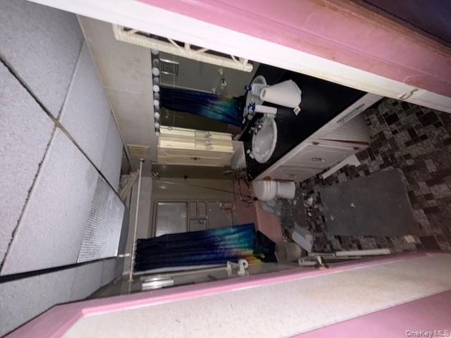 35 Marlow Road Valley Stream, NY 11580 - Photo 9 of 20 a bathroom with a double vanity sink and a mirror