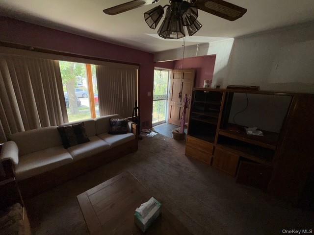 35 Marlow Road Valley Stream, NY 11580 - Photo 10 of 19 Carpeted living room with ceiling fan