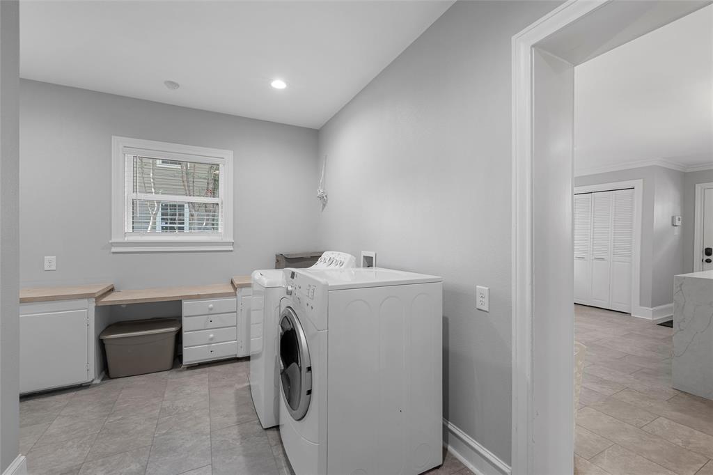 1500 South 10th Street Waco, TX 76706 - Photo 13 of 25 Laundry area featuring washer and clothes dryer, recessed lighting, and light tile patterned floors