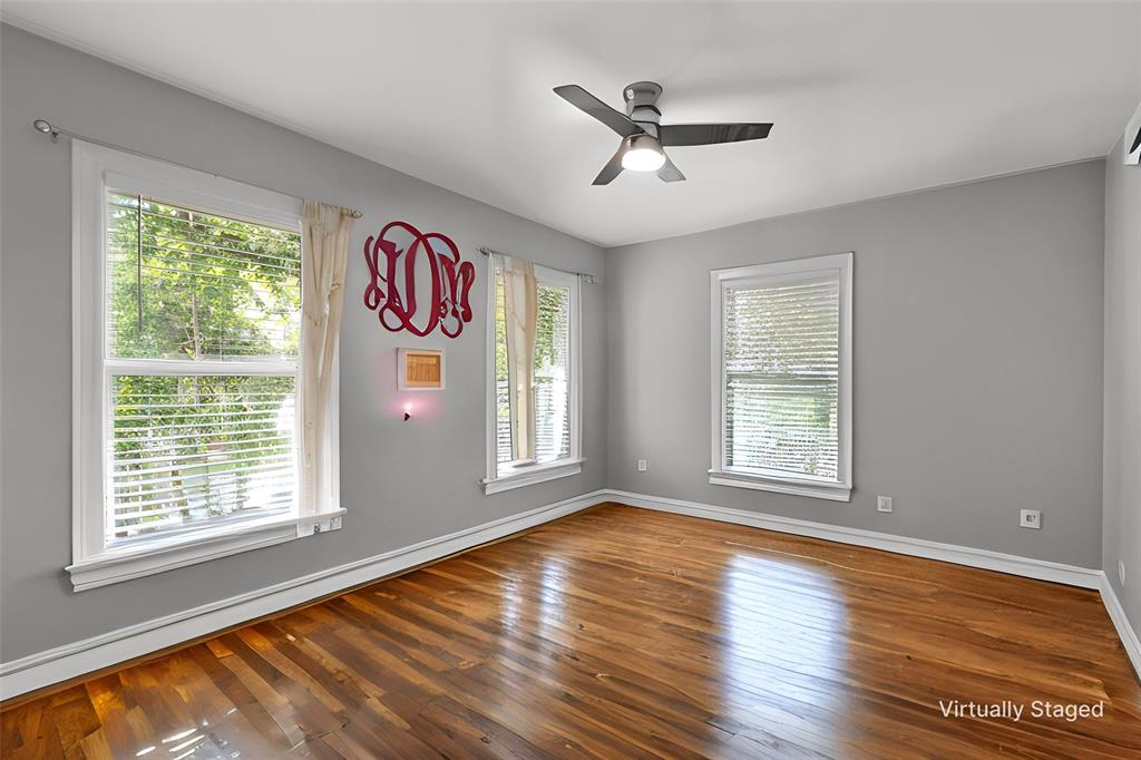 1500 South 10th Street Waco, TX 76706 - Photo 15 of 25 Empty room featuring wood-type flooring and a ceiling fan
