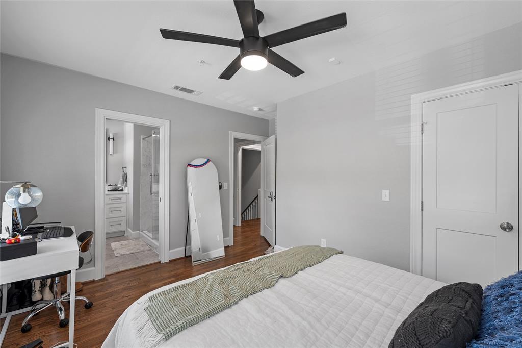 1500 South 10th Street Waco, TX 76706 - Photo 17 of 25 Bedroom with dark wood finished floors, a desk, a ceiling fan, and ensuite bathroom
