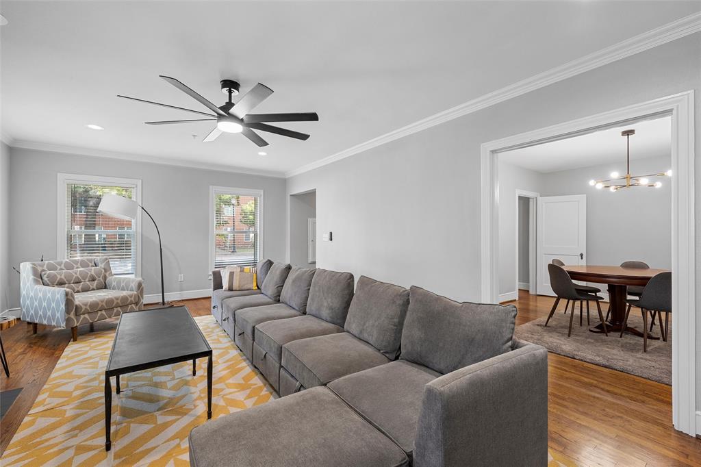 1500 South 10th Street Waco, TX 76706 - Photo 4 of 25 Living area featuring ornamental molding, light wood-type flooring, a chandelier, recessed lighting, and ceiling fan